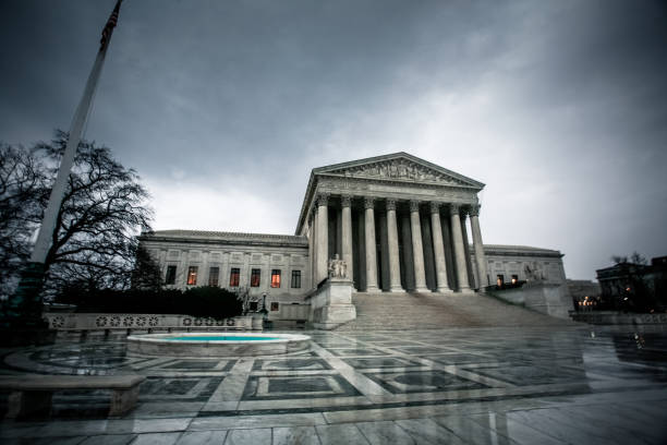 Dark Government: Supreme Court US Supreme Court Building under dark, gloomy skies in Washington D.C. us supreme court stock pictures, royalty-free photos & images