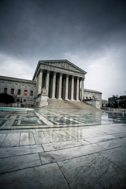 Dark Government: Supreme Court US Supreme Court Building under dark, gloomy skies in Washington D.C. calm before the storm photos stock pictures, royalty-free photos & images