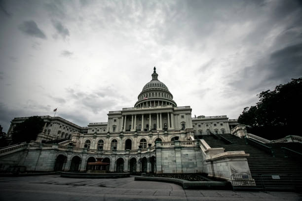Dark Government: US Capitol Building US Capitol Building under dark, gloomy skies. US Capitol Building in Washington D.C. calm before the storm photos stock pictures, royalty-free photos & images