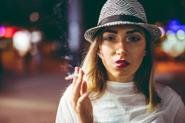 istock Pretty hipster woman with cigarette 1182400998