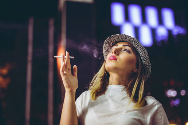 Pretty hipster woman with cigarette