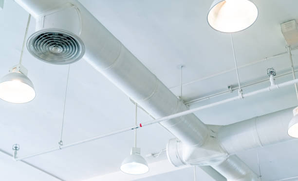istock Air duct, air conditioner pipe and fire sprinkler system on white ceiling wall. Air flow and ventilation system. Building interior. Ceiling lamp light with opened light. Interior architecture concept. 1182401668