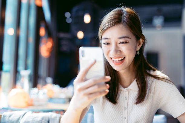 istock Asian Businesswoman using mobile phone. 1182406470