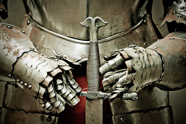 Medieval metal armour and sword. stock photo