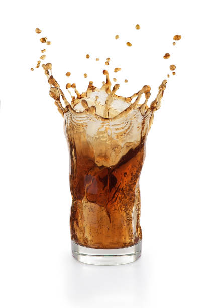 istock splash of cola in a plastic glass on a white background 1182412179