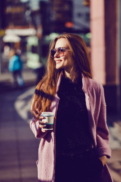 istock elegant lady drinking coffee 1182412998