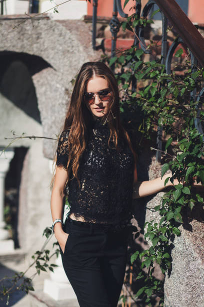 istock beautiful woman posing in sunglasses 1182413123