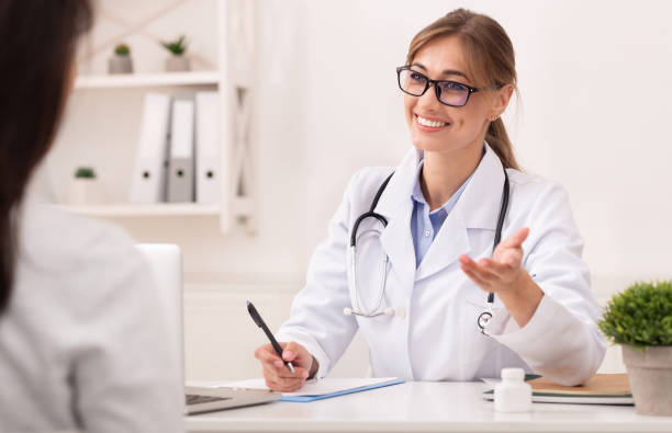 istock Smiling Therapist Talking With Unrecognizable Patient Sitting In Office 1182415609
