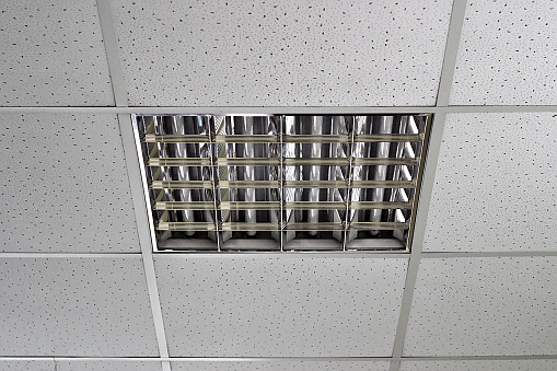 fluorescent light fixture on the suspended ceiling