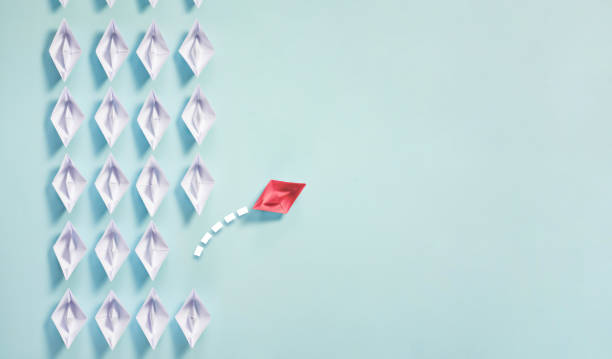 istock Leadership Concept with Paper Ship 1182418377
