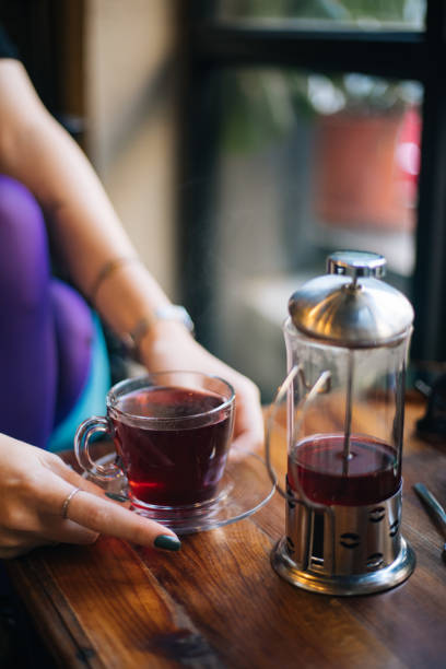 Woman having winter tea at coffee