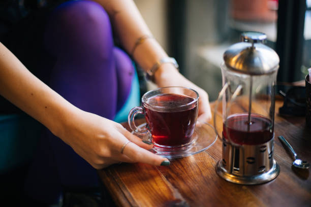 istock Woman having winter tea at coffee 1182420914