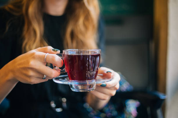 istock Woman having winter tea at coffee 1182420929