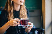 Woman having winter tea at coffee