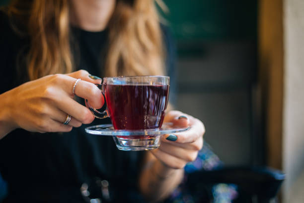 istock Woman having winter tea at coffee 1182421045