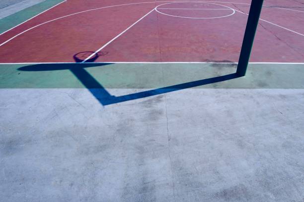 istock basketball hoop shadow silhouette on the court 1182421191