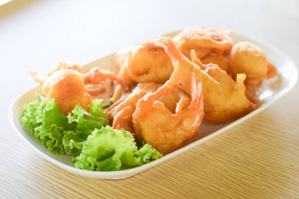 istock fried shrimp with vegetable on plate 1182421951