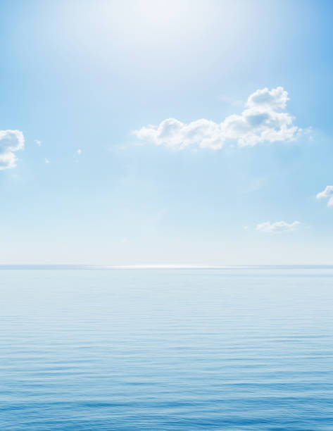 istock sunshine in blue sky with clouds over sea 1182423305