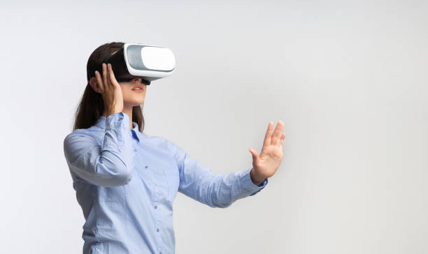 istock Millennial Girl Wearing Virtual Reality Headset Standing In Studio 1182425516