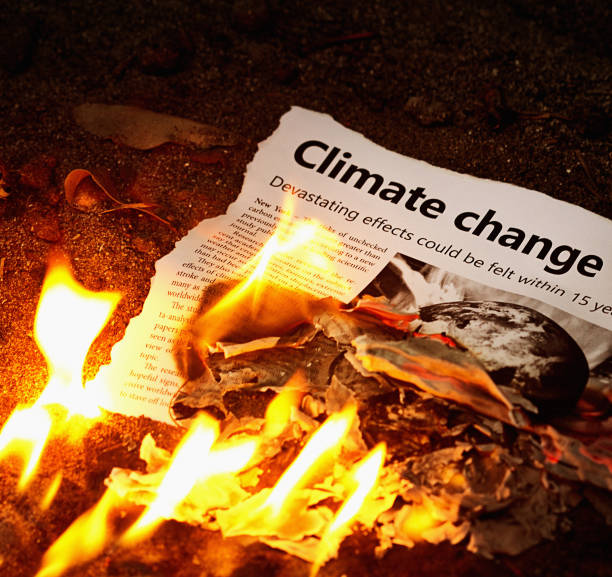 "Climate change" headline in flaming newspaper Please note: The design and text are my own creation. The illustration is a NASA earth image combined with a picture of my own. Thanks.
A burning newspaper bears the headline "Climate change". global warm stock pictures, royalty-free photos & images