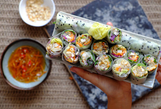 sliced vegan rice paper rolls on spring roll ingredient background