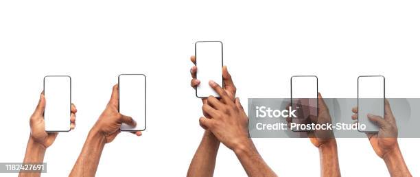 Mans Hands Using Smartphone With Blank Screen On White Background Stock Photo - Download Image Now