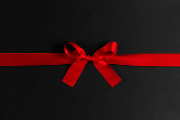 istock Shiny red satin ribbon bow 1182429570