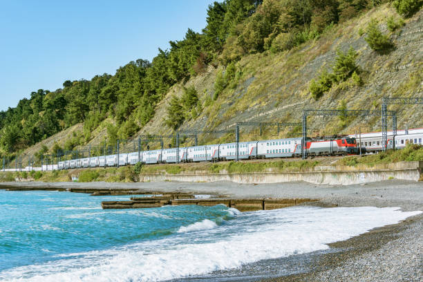 istock Passenger double deck train moves along Black sea coast. Sochi. 1182430362