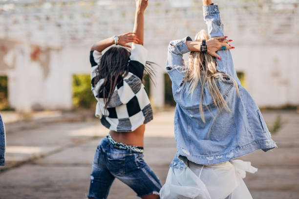 istock Two women street dancers 1182432200