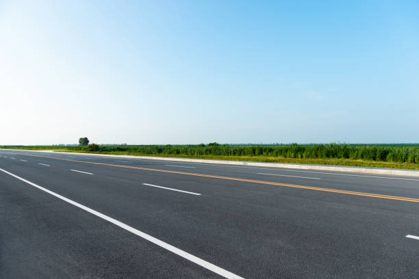 istock Empty asphalt road with yellow stripes 1182432229
