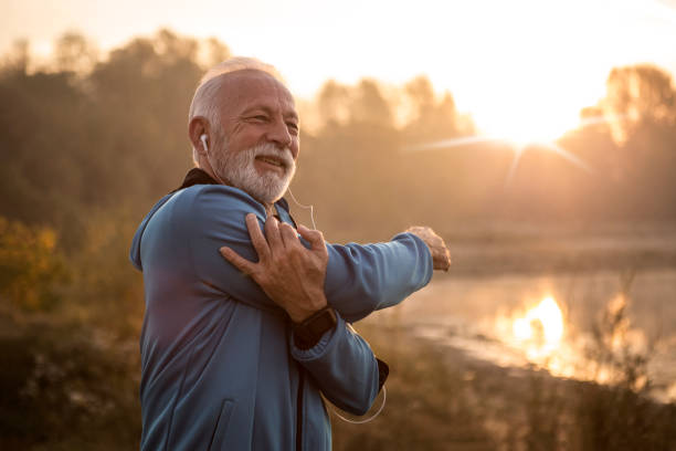 istock Mature man stretching arms getting ready for training 1182432690