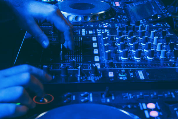 istock DJ playing music at mixer closeup 1182434229