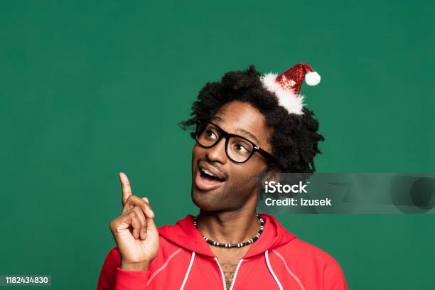Funny Christmas Portrait Of Happy Young Man Wearing In Red Stock Photo - Download Image Now