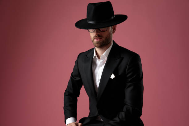 istock Confident mysterious man leaning on his leg 1182435006