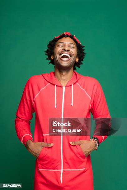 Funny Christmas Portrait Of Happy Young Man Wearing In Red Pajamas Stock Photo - Download Image Now