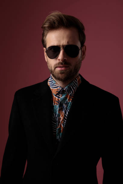 istock Motivated mysterious man looking forward while wearing a colorful shirt, 1182436319