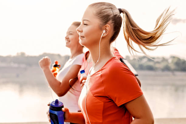 istock Friends running together 1182436419