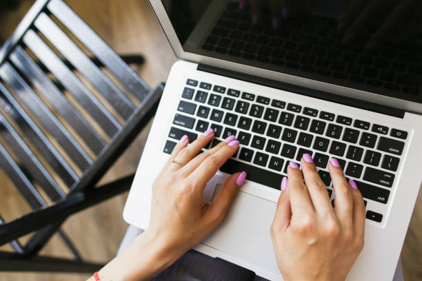 istock Closeup hands typing on laptop keyboard 1182436616