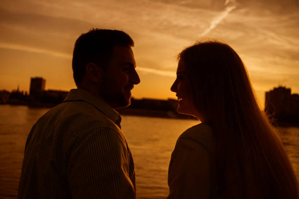 istock Young couple in sunset 1182437939