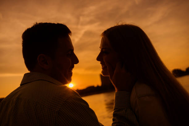 istock Young couple in sunset 1182438056