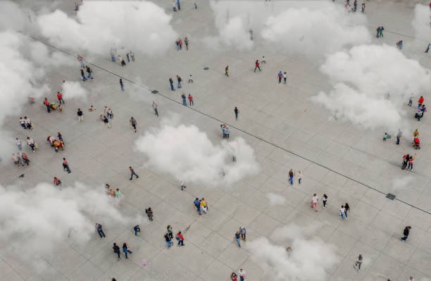 istock Aerial view of crowd with clowds 1182438218