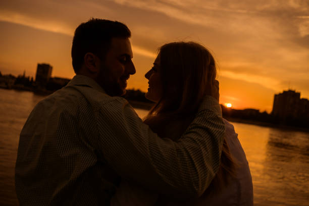 istock Young couple in sunset 1182438390