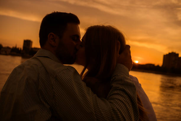 istock Young couple in sunset 1182438773