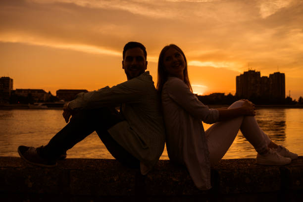 istock Young couple in sunset 1182438859