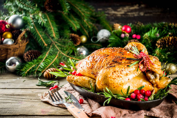 istock Roasted whole chicken with Christmas decoration 1182439773