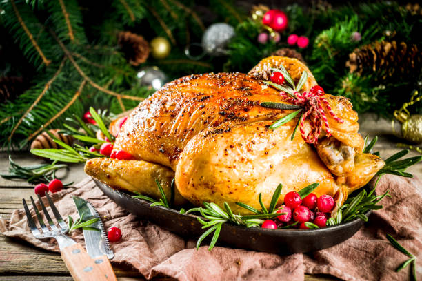 istock Roasted whole chicken with Christmas decoration 1182439788