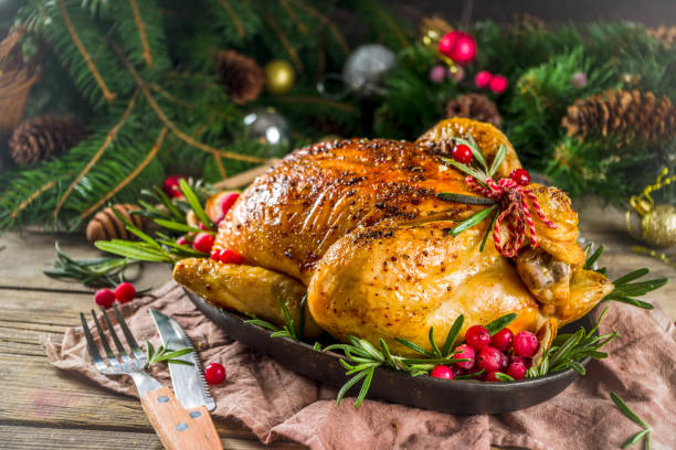 istock Roasted whole chicken with Christmas decoration 1182439860