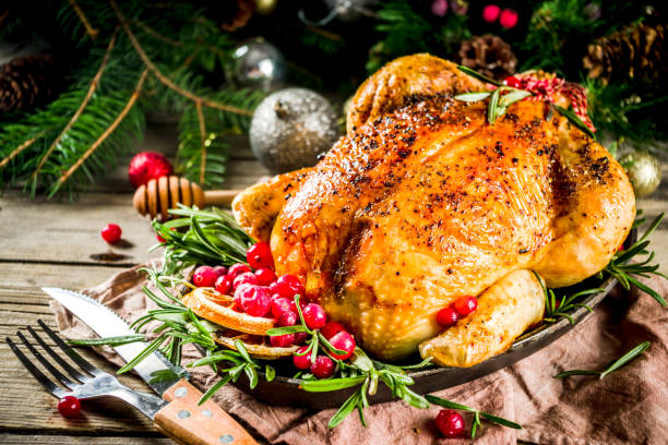 istock Roasted whole chicken with Christmas decoration 1182440015