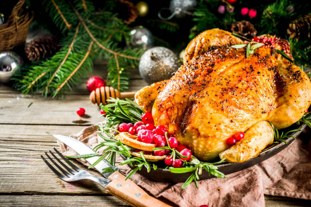istock Roasted whole chicken with Christmas decoration 1182440024