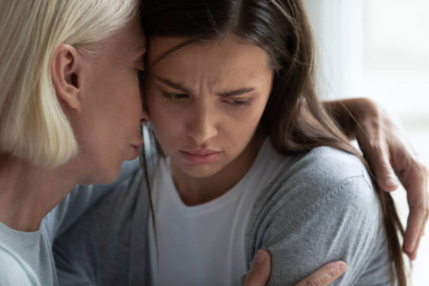istock Empathic middle aged woman hugging upset daughter. 1182440294